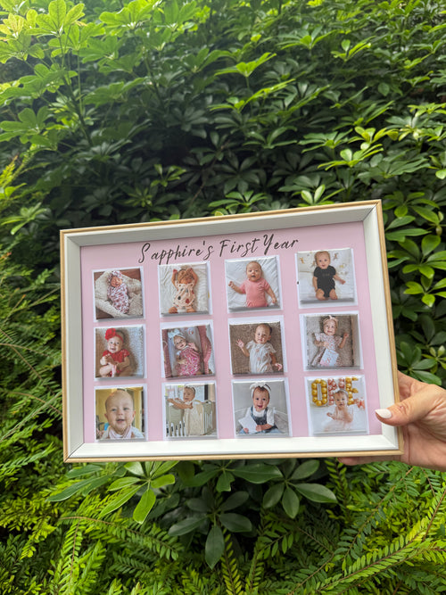 Framed collage of a baby's first year photos held in front of green foliage